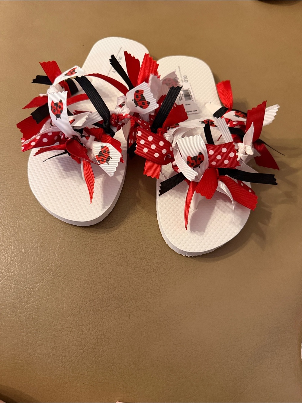 Old Navy White Flip Flops with Red, Black & White Ribbon Accents